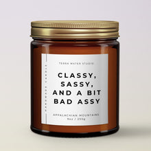 Load image into Gallery viewer, CLASSY SASSY AND A BIT BAD ASSY FUNNY SCENTED CANDLE IN AMBER JAR WITH LID ON