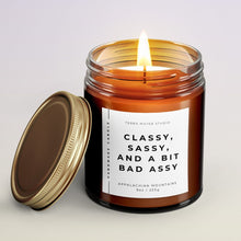 Load image into Gallery viewer, CLASSY SASSY AND A BIT BAD ASSY FUNNY SCENTED CANDLE IN AMBER JAR WITH LID ON SIDE