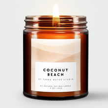 Load image into Gallery viewer, Scented candle in a glass jar labeled 'Coconut Beach' by Terra Mater Studio on a light background