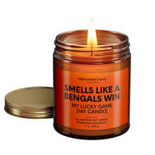 Load image into Gallery viewer, smells like a Cincinnati bengals win scented candle with lid on side