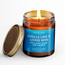 Load image into Gallery viewer, smells like a detroit lions win scented candle with lid on side