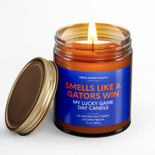 Load image into Gallery viewer, smells like a Florida gators win scented candle with lid on side