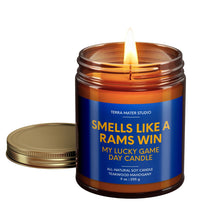 Load image into Gallery viewer, smells like a los angeles rams win scented candle with lid on side