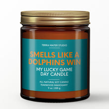 Load image into Gallery viewer, smells like a miami dolphins win scented candle with lid on