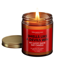 Load image into Gallery viewer, smells like a new jersey devils win scented candle with lid on side