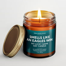 Load image into Gallery viewer, smells like a Philadelphia eagles win scented candle with lid on side
