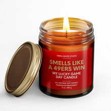 Load image into Gallery viewer, smells like a san francisco 49ers win scented candle with lid on side