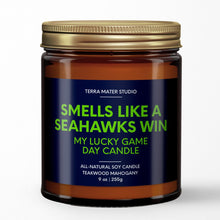 Load image into Gallery viewer, smells like a seattle seahawks win scented candle with lid on side