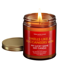 Load image into Gallery viewer, smells like a tampa bay buccaneers win scented candle with lid on side
