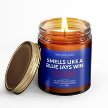 Load image into Gallery viewer, smells like a toronto blue jays win scented candle with lid on side