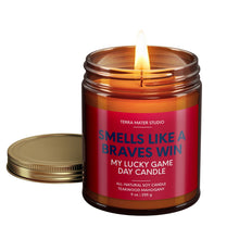 Load image into Gallery viewer, smells like an atlanta braves win scented candle with lid on side