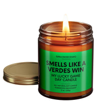 Load image into Gallery viewer, smells like an austin verdes win scented candle with lid on side