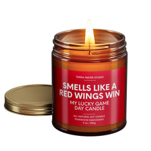 Load image into Gallery viewer, smells like detroit red wings win scented candle with lid on side