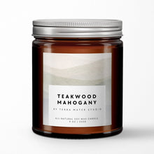 Load image into Gallery viewer, Teakwood Mahogany soy wax candle in a glass jar with a metal lid on a white background