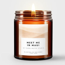 Load image into Gallery viewer, Scented Candle in an amber jar with a label reading 'Meet Me in Maui' by Terra Mater Studio on a light gray background.
