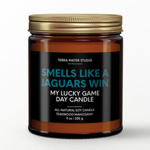 Load image into Gallery viewer, smells like a jacksonville jaguars win scented candle with lid on
