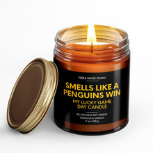 Load image into Gallery viewer, smells like a pittsburgh penguin win scented candle with lid on side
